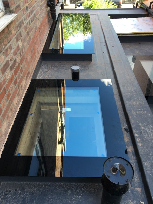 Multiple flat roof skylights on extension in Hither Green